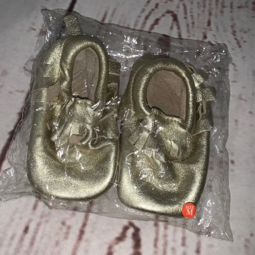 Gold moccasins 6-12 months